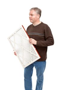 person-carrying-an-air-filter