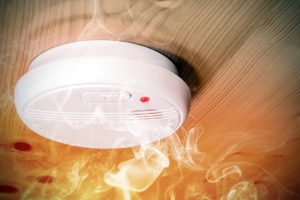 smoke-and-carbon-monoxide-detector-surrounded-by-smoke