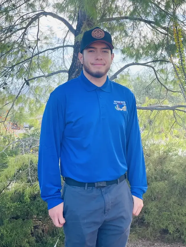 Luke Arenas in a Picture Rocks polo and cap